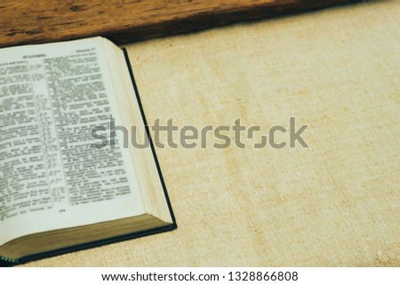 Open Holy Bible on a old  table. Beautiful background. Religion concept.