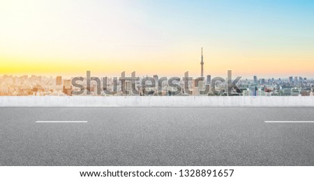 Business and design concept - Empty asphalt road with panoramic modern cityscape aerial view under bright blue sky of Tokyo, Japan for mockup