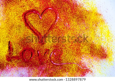 Heart shape Love on red and yellow powder