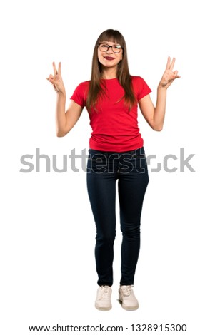 Full-length shot of Woman with glasses smiling and showing victory sign with both hands