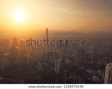 Aerial view of Kuala Lumpur Downtown, Malaysia. Financial district and business centers in smart urban city in Asia. Skyscraper and high-rise buildings at sunset.