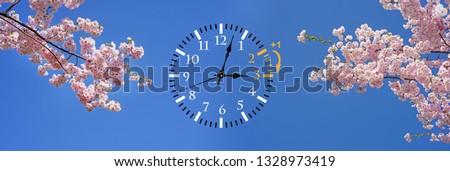 Daylight Saving Time. DST. Wall Clock going to winter time. Turn time forward. Abstract photo of changing time at spring. Royalty-Free Stock Photo #1328973419