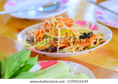 papaya salad with crab on table 