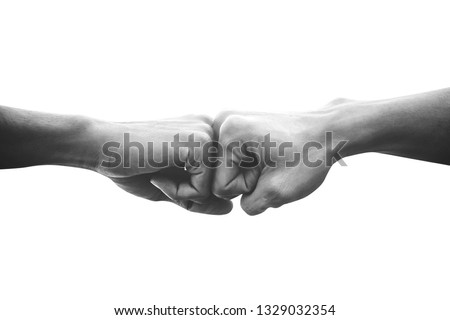 Hands of man people fist bump team teamwork and partnership business success, Black and white image Royalty-Free Stock Photo #1329032354
