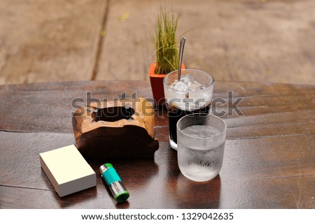 Glass cups of drinking water and small stuff on the table