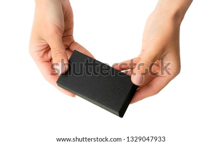 Woman holding stack black business cards in hands isolated on a white background. Tamplate for your design.