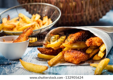 Closeup of Fish & Chips served in paper Royalty-Free Stock Photo #132905624