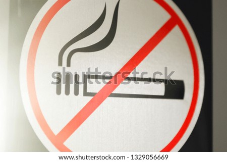 Sign smoking is prohibited close-up. Toned