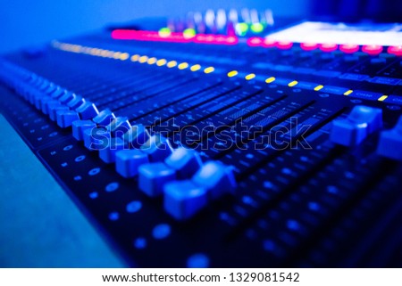 Mixers Audio Interfaces Blue light tone Royalty-Free Stock Photo #1329081542
