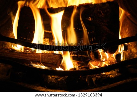 Close up of logs burning on a open fire