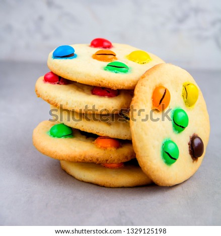 Stack of Shortbread cookies with multi colored candy .  Close up. Square. Homemade cookies for children. One object. Dessert.