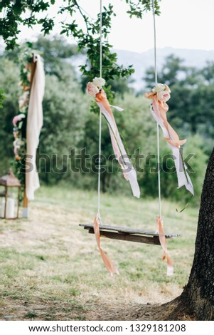 Italian wedding decoration. Green eucalyptus, oranges and pink flowers decorate wedding altar