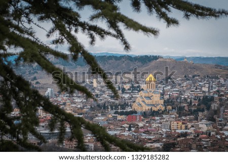 Panoramic view of Tbilisi, church in the foreground