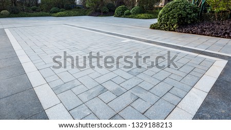 Grey marble floor tiles on garden square in residential area。Sidewalk, Driveway, Pavers, Pavement in Vintage Design Flooring Square Pattern Texture Background Royalty-Free Stock Photo #1329188213