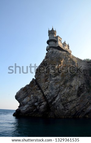 Castle Swallow Nest, Yalta, Crimea, Russia. Monument of architecture on a cliff with a rift over the Black Sea. Vertical photo