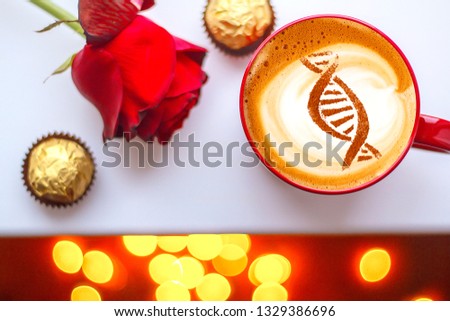 a cup of cappuccino coffee with a picture of a chain of dna