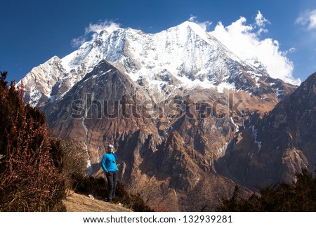 girl among the snow, the high mountains of the Himalayas