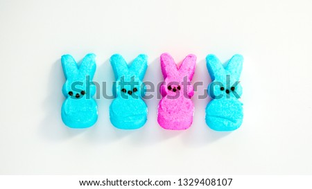 diversity-four pink and turquoise marshmallow peep Easter bunnies isolated on a white background Royalty-Free Stock Photo #1329408107
