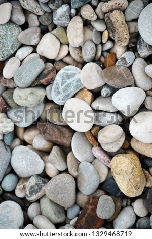 abstract background with dry round reeble stones. Sea stones texture