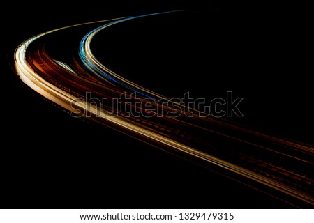 Car Light trails on the intersection road in istanbul, abstract long exposure traffic lights. blur motion of cars on the city road at night