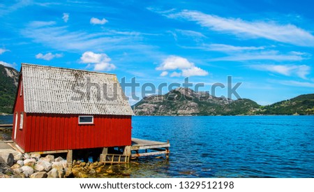 Amazing nature view with beautiful houses on the shore of the fjord. Location: Forsand, Norway, Europe. Artistic picture. Beauty world. 