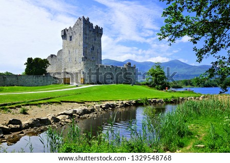 Medieval Ross Castle along the shores of Lough Leane in Killarney National Park, Ring of Kerry, Ireland Royalty-Free Stock Photo #1329548768