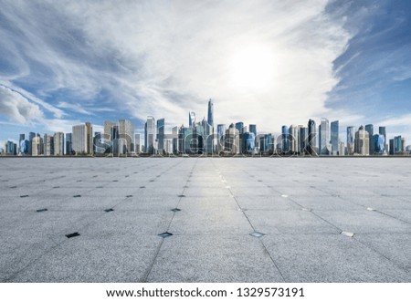 Empty square floor and panoramic city skyline with buildings in Shanghai