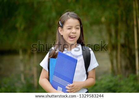 Diverse Student Child Making Funny Faces With Books
