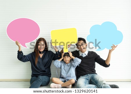 Families  holding  sign colorful speech bubble.