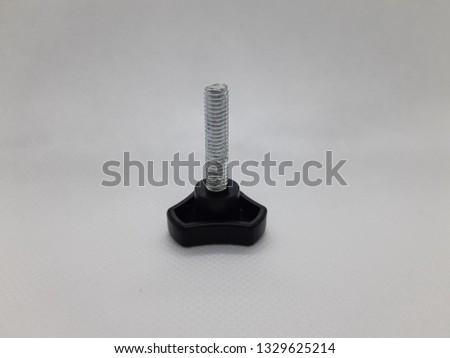 Isolated photo of a screw with plastic top