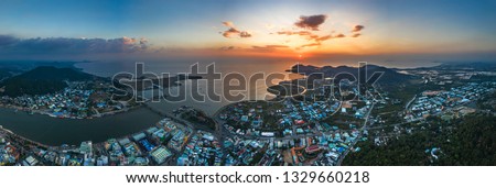 Top view aerial of Ha Tien City with development buildings, transportation, energy power infrastructure. Famous tourist city of Vietnam, sharing the border with Cambodia