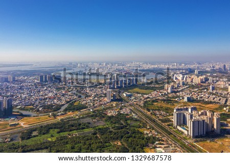 Top view aerial of Mai Chi Tho street. Ho Chi Minh City with development buildings, transportation, energy power infrastructure. Vietnam. View from Cat Lai crossroads