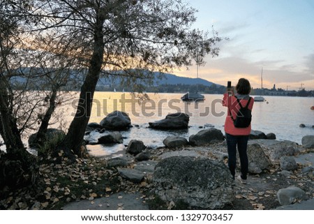 Photographer at lake Zuerich in summer time
