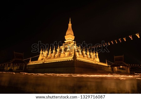 Phra That Luang (Golden Pagoda) at the candle light at night, Laos, Vientiane