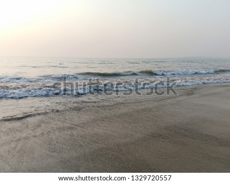 Taken on Smartphone. this is a picture of waves coming on the shore of Juhu beach in Mumbai. This is one of the favorite locations for people of Mumbai to spend an evening with loved ones.