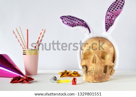 Funny skull with hair hoop in shape of rabbit ears and carnival accessories set. Decoration for party 1 April day or Mexican Day of the dead (Dia de los muertos). April fools day prank.