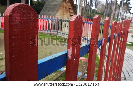 Wood fence Colorful red and blue in garden