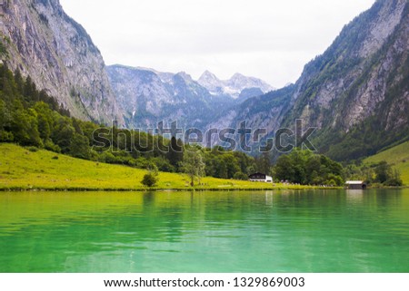 Large stone mountains in the Alps on Konigssee Lake.