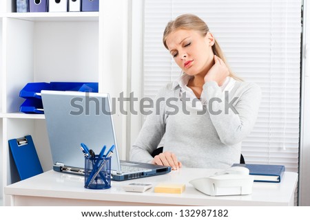 Businesswoman having pain in her neck,Neck pain at work Royalty-Free Stock Photo #132987182