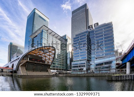 The modern skyscrapers of the financial district Canary Wharf in London, UK, on a sunny day Royalty-Free Stock Photo #1329909371