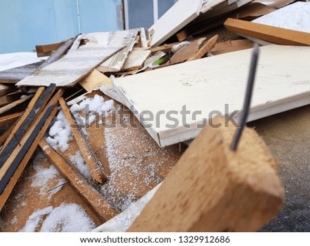 nails and old boards in a pile of construction waste after repair
