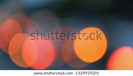 Defocused, blurred bokeh and abstract blurry of red taillights moving on night street. Royalty high-quality free stock photo image of colorful red light in night, glowing backdrop overlay for design