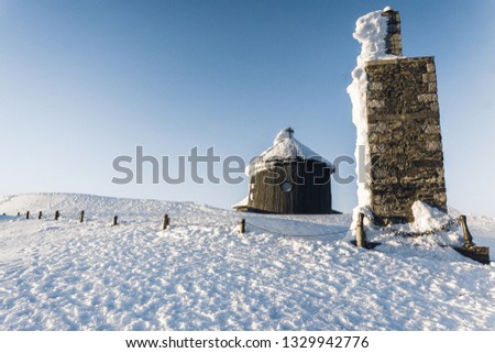 Polish chalet on Snezka peak. Snowy winter countryside, Snezka mount - Ruzova hora, Krkonose (Giant mountains), Czech republic