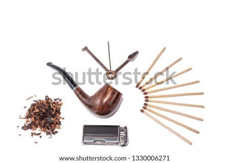 Pipe, accessory and tobacco isolated on white