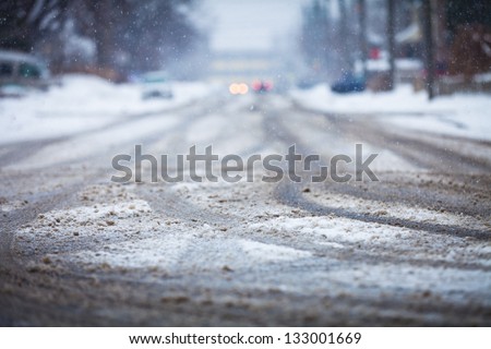Snow-covered road, the marks of wheels Royalty-Free Stock Photo #133001669