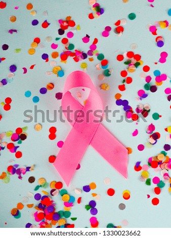 pink ribbon on multicolored background,Breast cancer awareness concept.