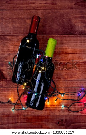 Two Bottles of Wine: Flat lay overhead shot of a bottle of blush wine on a wood table