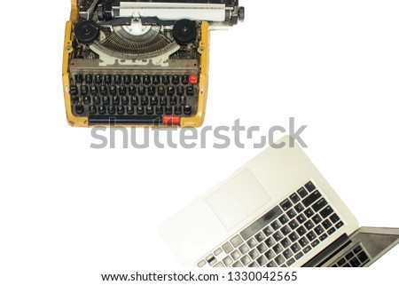 Vintage typewriter and a new model of laptap on a white background