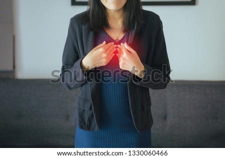 Asian woman having or symptomatic reflux acids,Gastroesophageal reflux disease,Because the esophageal sphincter that separates the esophagus and stomach dysfunction Royalty-Free Stock Photo #1330060466