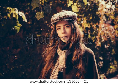 Fashion autumn portrait woman with yellow maple leaves on Nature Background. Fall concept. Autumn Park. Autumn woman in autumn park with red pullover